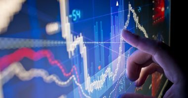 Stock market chart on a screen showing volatility.