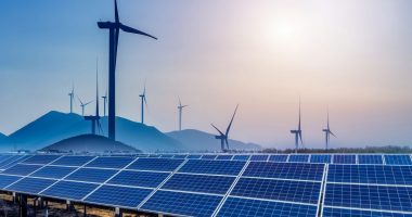 Wind turbines with the sun in the background