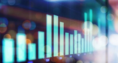 Graph on screen showing up and down stock market numbers