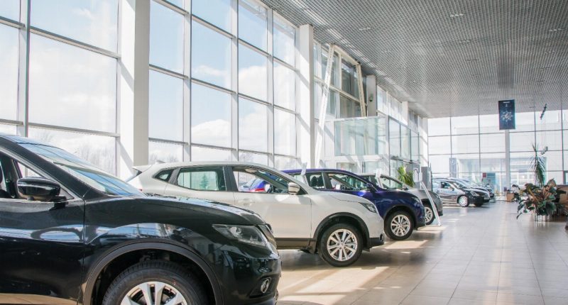 cars lined up in an automotive dealership