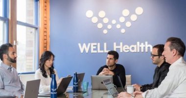 WELL Health founder and CEO Hamed Shahbazi, centre.