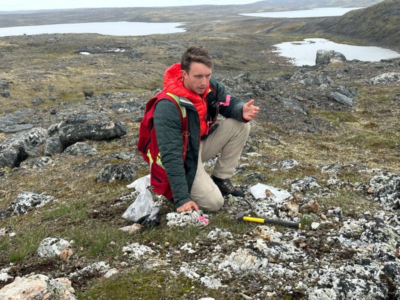 Eureka Lithium - Ground Truth Exploration team member sampling pegmatites at Raglan West.