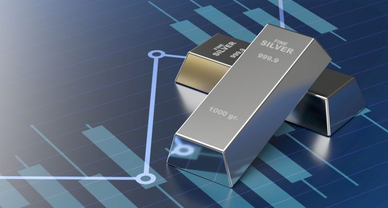 silver ingot bars on economy and finance line chart surface