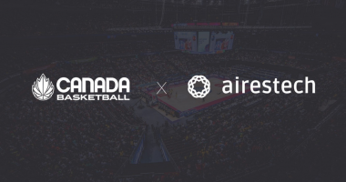 Canada Basketball X Airestech logos across a darkened image of a basketball arena