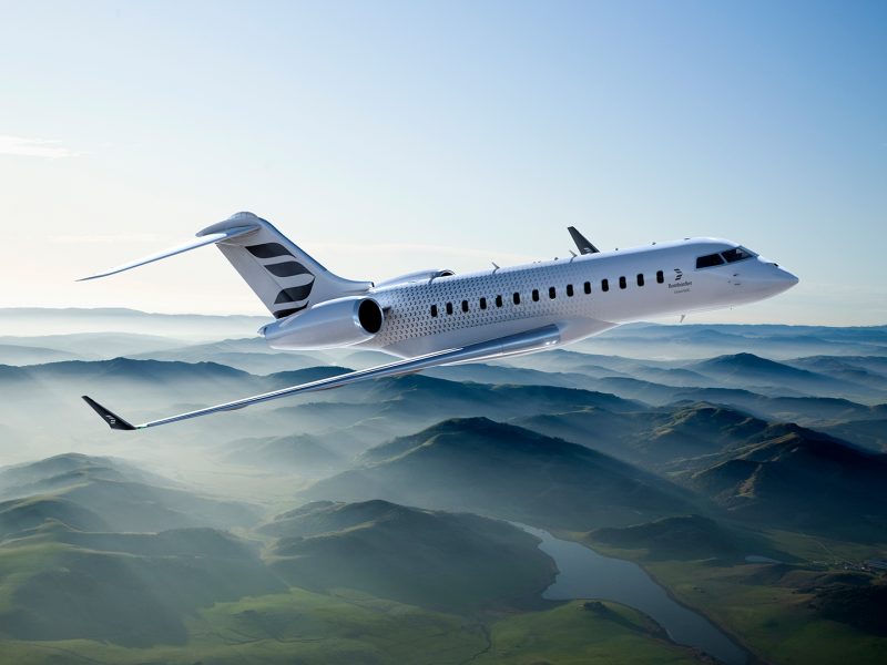 A Bombardier Global 5500 aircraft flying in the clouds