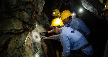 CEO Alexandre P. Boivin (in the center) and his team examining mineralization at the Tahami Project.