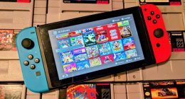 A Nintendo Switch console on top of a bunch of Super Nintendo game cartridges.