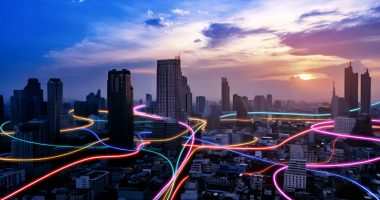 Neon lights winding around city roads.