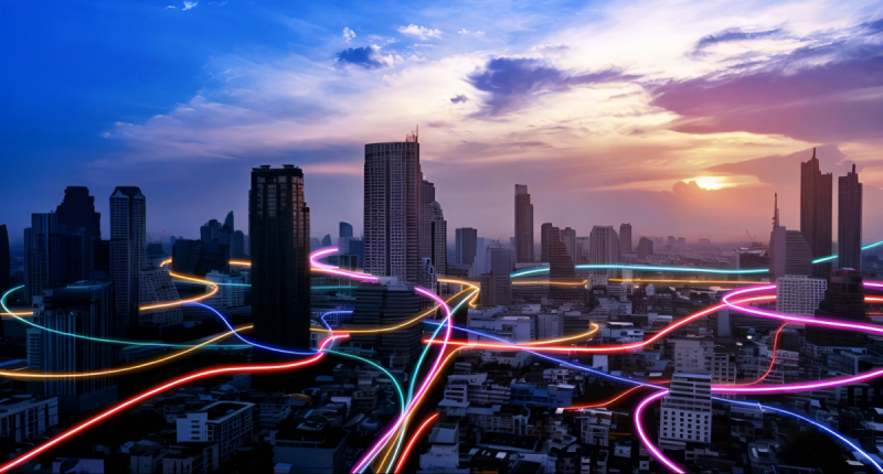 Neon lights winding around city roads.