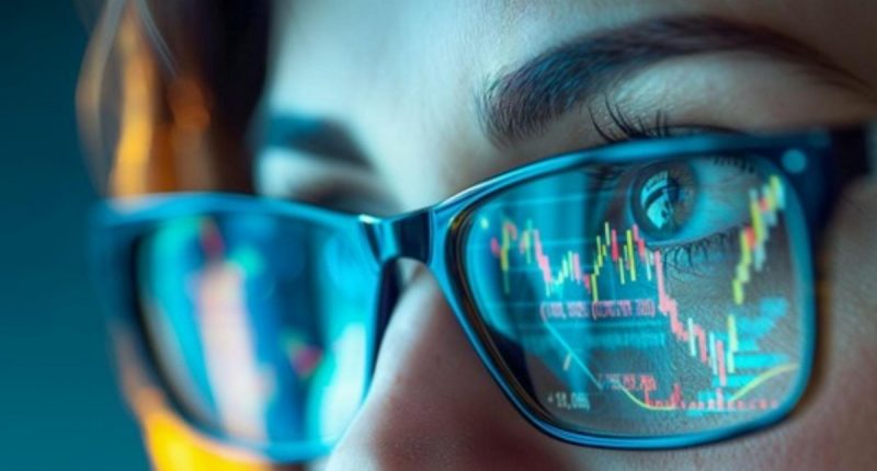 Stock chart reflected in woman's eyeglasses