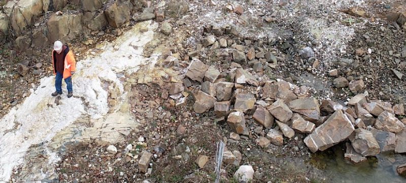 Northstar Gold worker surveying a dig site.