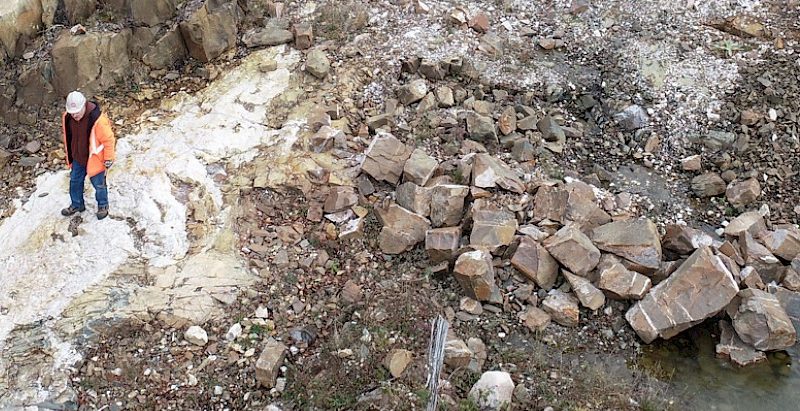 Northstar Gold worker surveying a dig site.