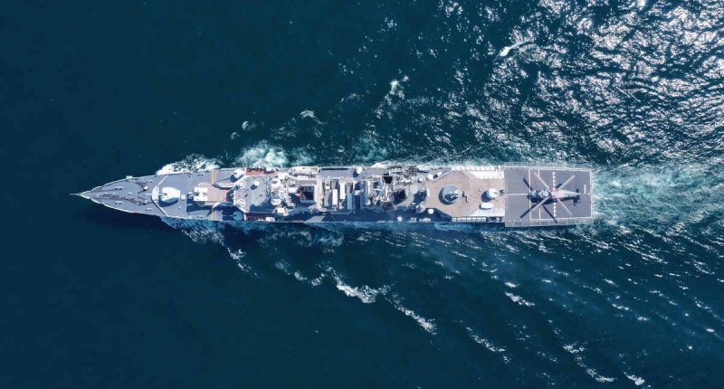 Aerial view of naval ship on the ocean