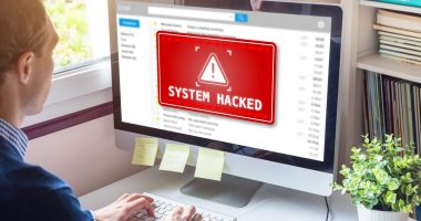 System hacked alert on computer screen after cyber attack on network.