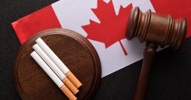 Flag of Canada, cigarettes and a gavel.