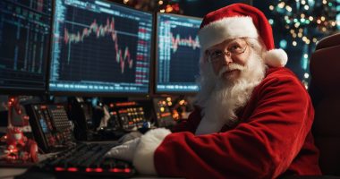 Santa looking at stock charts