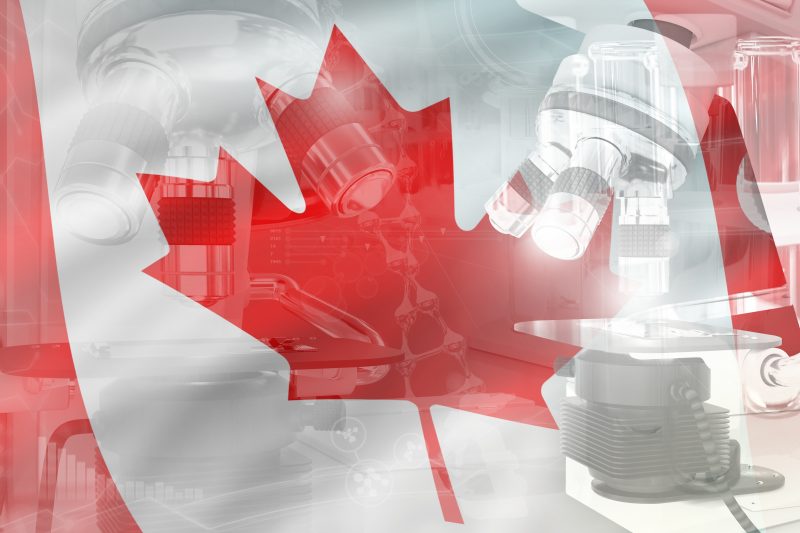 Canadian flag, medical equipment and stock chart