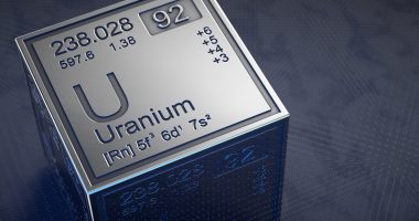 Uranium specs on metal block