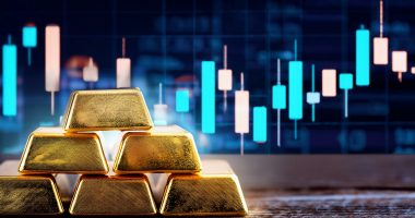 Gold bars and stock chart