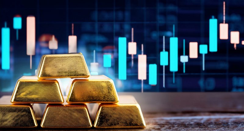 Gold bars and stock chart