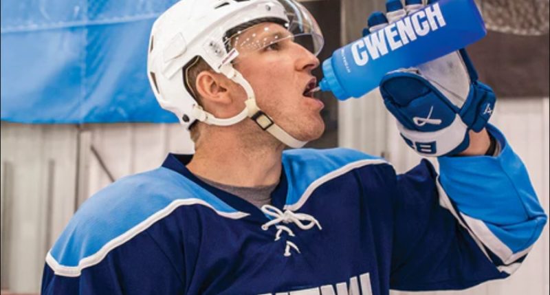 A hockey player drinking Qwench via Cizzle Brands Corp.